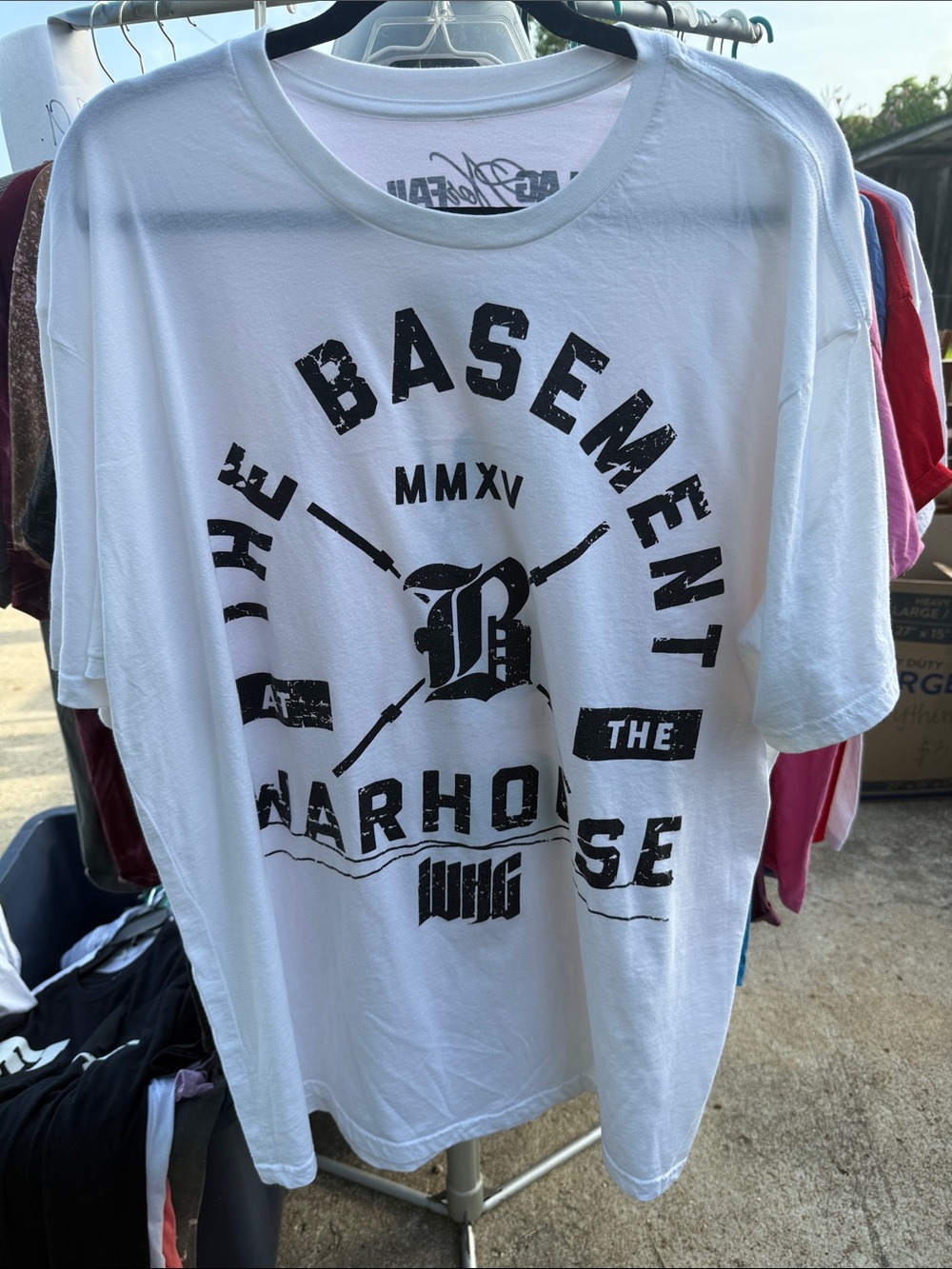 White Graphic Tee with Black 'Basement' Print
